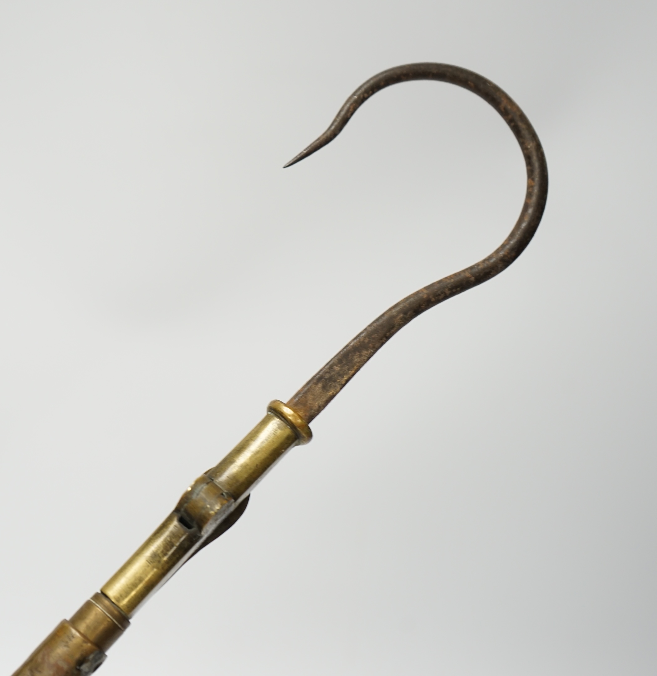 A 19th century folding and extending salmon gaff with cork grip, 58.5cm long. Condition - cork handle damaged one end